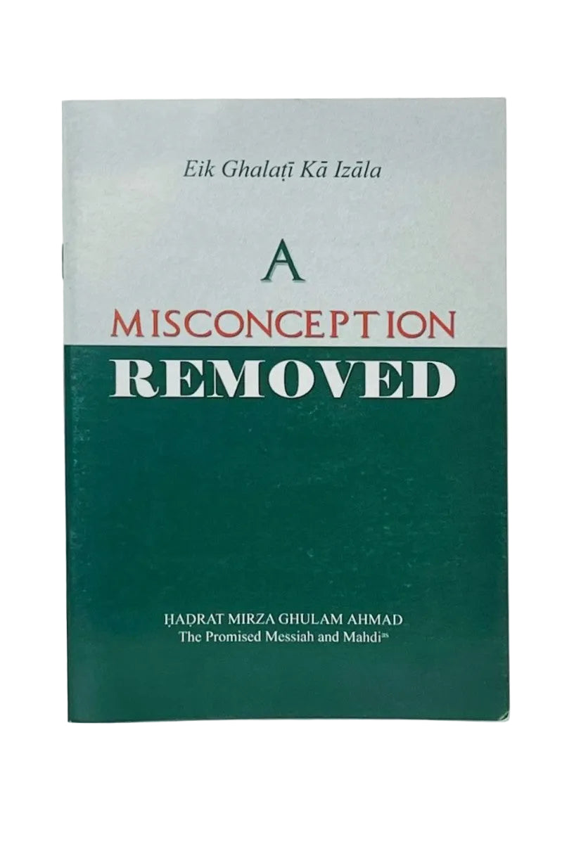 A book titled 'A MISCONCEPTION REMOVED' by Ijadrat Mirza Ghulam Ahmad, featuring a dark green and light gray cover with red and white text, photographed on a light gray background.