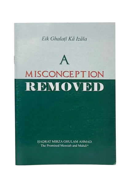 A book titled 'A MISCONCEPTION REMOVED' by Ijadrat Mirza Ghulam Ahmad, featuring a dark green and light gray cover with red and white text, photographed on a light gray background.