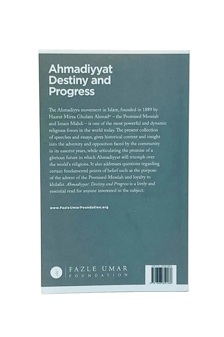 The back cover of a book titled 'Ahmadiyyat Destiny and Progress' by Fazle Umar, published by the Fazle Umar Foundation. The cover is a muted teal-green color with white text, photographed standing upright against a light off-white background.