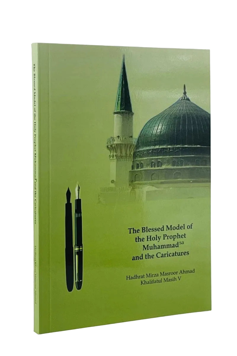 A hardcover book titled 'The Blessed Model of the Holy Prophet Muhammad and the Caricatures' with a light green cover featuring a mosque dome and minaret, two black fountain pens, and author names Hadhat Mirza Masroor Ahmad and Qudratul Maash V, shown on a white background.