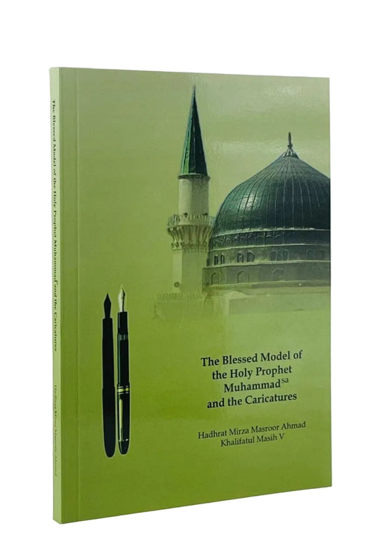 A hardcover book titled 'The Blessed Model of the Holy Prophet Muhammad and the Caricatures' with a light green cover featuring a mosque dome and minaret, two black fountain pens, and author names Hadhat Mirza Masroor Ahmad and Qudratul Maash V, shown on a white background.