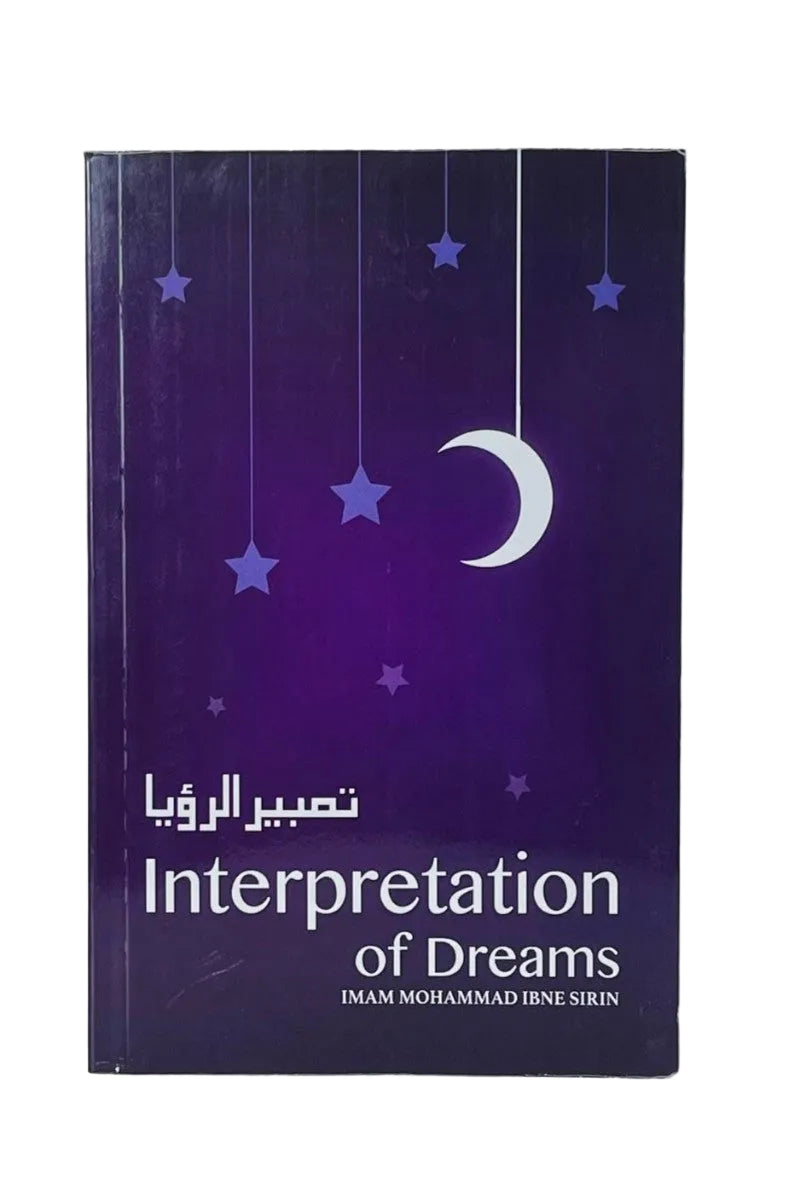 A hardcover book titled 'Interpretation of Dreams' with Arabic text above it, featuring a dark purple cover decorated with hanging stars and a crescent moon, photographed against a plain light background.