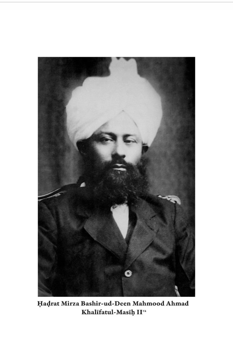 Black and white portrait of a man with a turban and beard, wearing a formal coat.